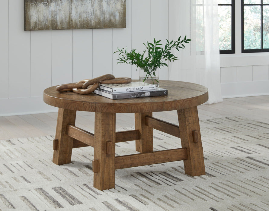 Mackifeld - Round Cocktail Table - Warm Brown