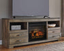 Trinell - 63" TV Stand With Glass/Stone Fireplace Insert - Brown